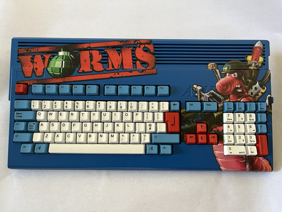 A custom Amiga 1200 case featuring Worms artwork.