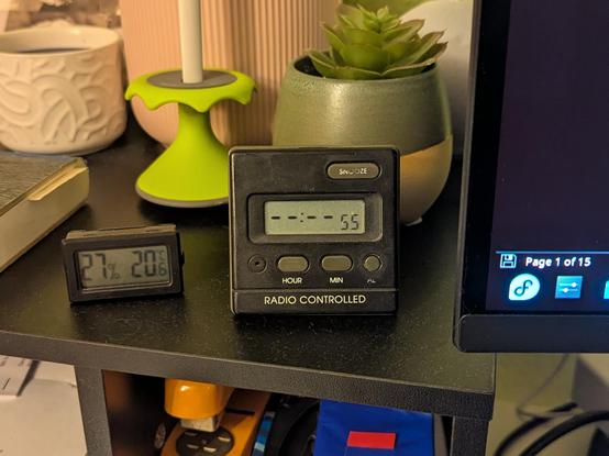 Radio controlled Alarm clock showing "--:--:55". The button texts are faded from age