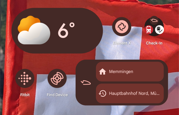 Screenshot eines Homescreens mit Anwendungen, einem Wetterwidget und dem Träwelldroid-Widget, das das Träwelldroid-Logo und zwei Optionen zum Check-In in die Heimatstation und die zuletzt besuchte Station ermöglicht
