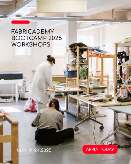 A view of Green Fabric textile fablab with people working on their projects.