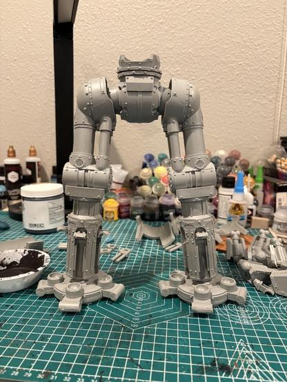 The legs of the reaver Titan. The stance is fairly straight with the legs close to shoulder width apart.