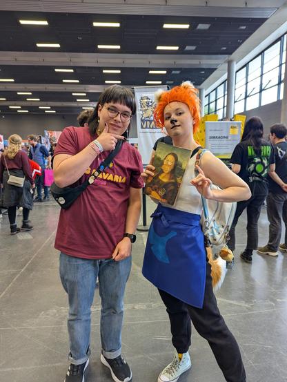 Me and someone cosplaying Redd (Reiner) from Animal Crossing at GGBavaria.
Redd is holding a fake Mona Lisa Painting.