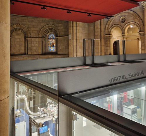 The MareNostrum Supercomputer inside the chapel in Barcelona. The contrast between cutting-edge technology and historic religious architecture creates a powerful atmosphere. Inspired by “Navras” by Don Davis & Juno Reactor, evoking Matrix Revolutions vibes. A Latin quote reflects on the enduring promise of Christ’s presence throughout time: «Lux veritatis temporumque testis historia docet, si modo recte dispiciatur diligenterque exploretur, divinam illam a Iesu Christo datam pollicitationem: «Ego vobiscum sum... usque ad consummationem saeculi» numquam Ecclesiae suae sponsae defuisse, adeoque numquam esse in posterum defuturam».