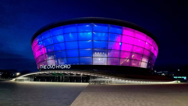 The Hydro Arena in Glasgow lit up against the night's sky.