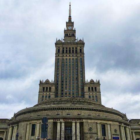 Low angle view of the palace’s tower under a cloudy winter sky.