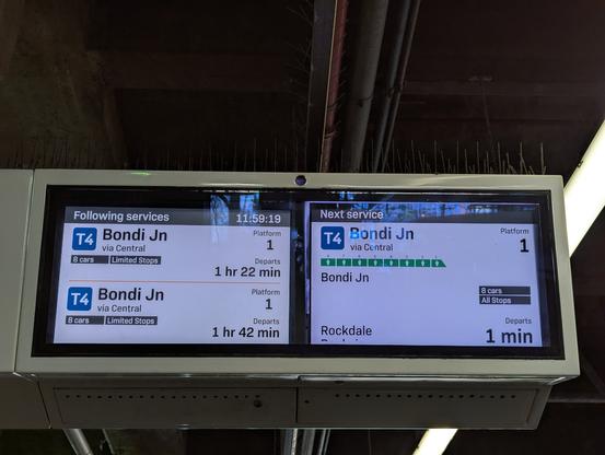 Sydney train station board showing next train leaving in one minute, while the ones after that only leave in 1hr 32 minutes