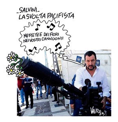 Salvini. La svolta pacifista. 

Nella fotografia, Matteo Salvini ritratto con un mitragliatore in mano dal quale escono dei fiori canta: "Mettete dei fiori nei vostri cannoonii".