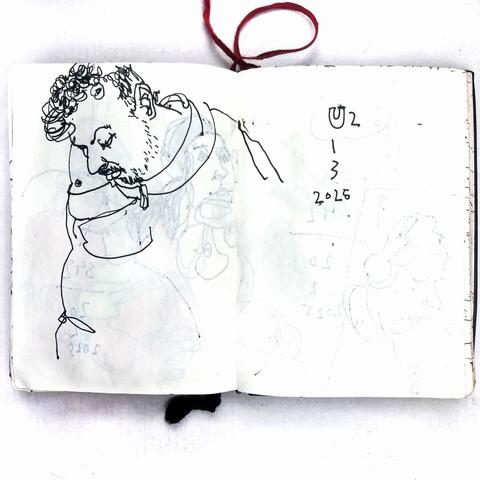 photo of a small sketchbook with a pen drawing from a berlin u-train