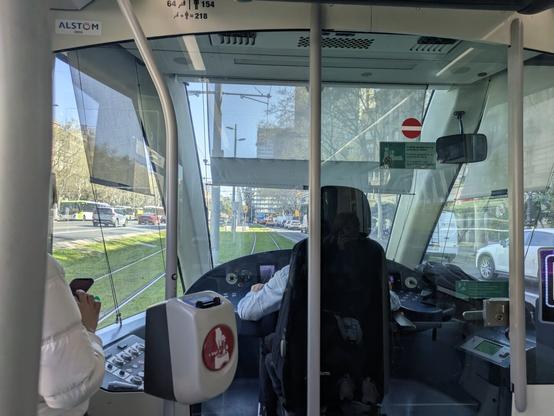 View of the driver and outside the front window of a tram