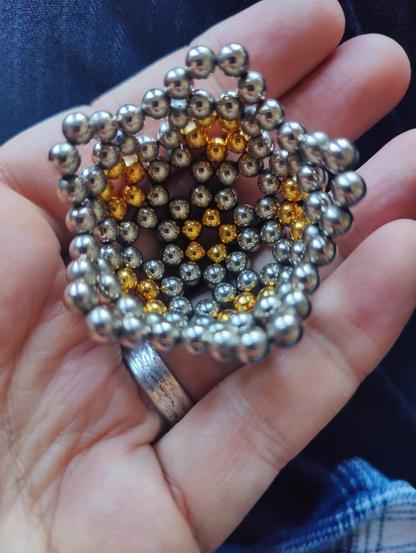 One more layer: fifteen hexagons now, giving a more pentagonal appearance.