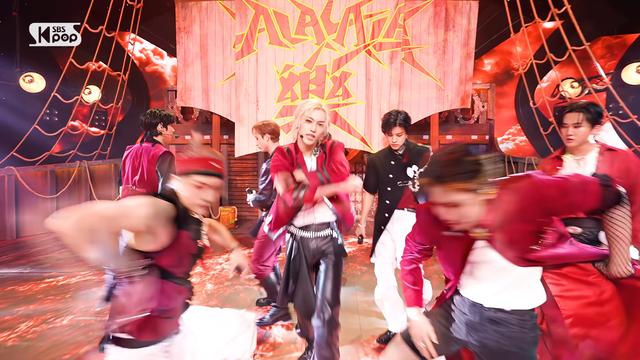 skz performing on a music show. Felix has a black scarf (?) attached to his right hip