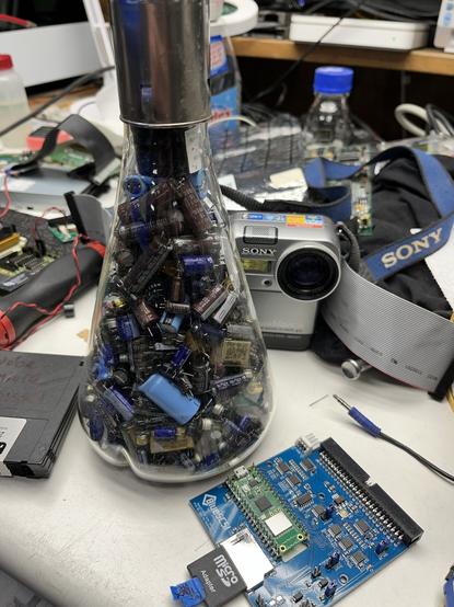 Erlenmeyer flask with a lot of caps in it