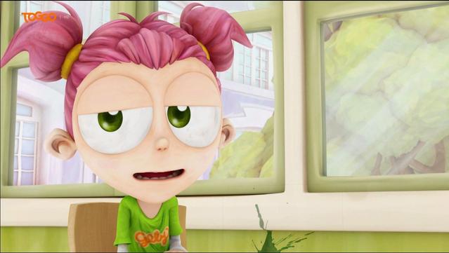 Description: The image shows a cartoon girl with pink hair and green eyes sitting on a chair in front of a wall with windows, through which a building and trees can be seen. She is wearing a green t-shirt and there is a watermark in the top left corner of the image.

Disclaimer: This image description was automatically generated and may not be entirely accurate.
