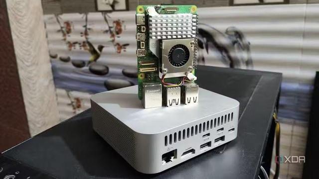 Photo of a Raspberry Pi sitting on top of a Mac Mini