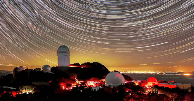 The light pollution of Tucson, Arizona can be seen in the backdrop of this photo of Kitt Peak National Observatory, with the Nicholas U. Mayall 4-meter Telescope featured prominently. In addition to being an aesthetic blight, light pollution poses one of the greatest risks to astronomical research at Kitt Peak, drowning out the natural starlight and the light from distant asteroids, comets, galaxies, quasars, and other objects in the night sky. Creator: KPNO/NOIRLab/NSF/AURA/B. Tafreshi (CC BY 4.0)