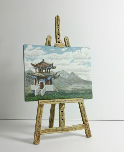 Dollshouse scale painting on an easel.