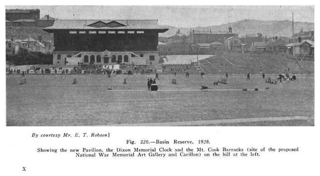 Black-and-white photo: Basin Reserve, 1928. Showing the new Pavilion, the Dixon Memorial Clock and the Mt. Cook Barracks (site of the proposed National War Memorial Art Gallery and Carillon) on the hill at the left. Description: A view across the playing field, on which several people are standing, towards the pavilion, terraces and then to the hills behind the sports ground. Citation: Louis E. Ward, _Early Wellington_, Whitcombe and Tombs, 1928, p. 369. https://digitalnz.org/records/1541364/fig-220basin-reserve-1928-showing-the-new-pavilion-the-dixon-memorial-clock