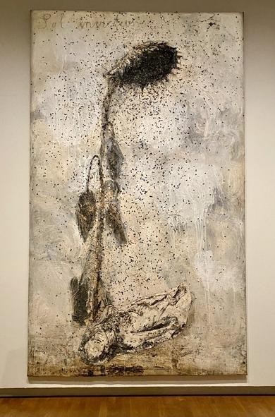 Tall painting of huge sunflower raining seeds on the artist in savasana pose