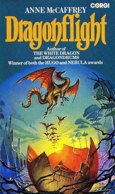 Dragonflight by Anne McCaffrey is a breathtaking display of fantasy and adventure. The title, "Dragonflight," is emblazoned in bold, golden-yellow lettering, evoking a sense of grandeur and mythical wonder. Above it, the author’s name, Anne McCaffrey, is prominently featured, alongside a note recognizing her status as the winner of both the Hugo and Nebula Awards, a testament to her literary prowess. 

The central image is a majestic dragon in mid-flight, its golden-orange wings spread wide as it soars against a rich blue sky. The dragon's body is sinuous and powerful, covered in shimmering scales, its claws extended as if ready to strike. Beneath it, a rider clings to its back, a small but determined figure silhouetted against the sky.

The background portrays a dramatic volcanic landscape, with jagged, obsidian-like peaks surrounding a fiery, glowing crater. Smaller dragons rise from the inferno, flying in formation, reinforcing the sense of an ancient and powerful bond between dragonkind and their riders. The contrast between the cool blue sky and the warm, molten hues below creates a dynamic tension, suggesting both peril and wonder in the world of Pern.

The cover perfectly captures the epic and thrilling nature of McCaffrey’s novel, where dragons are more than just mythical beasts—they are the guardians of a world in peril, bound to their riders in a legendary fight for survival.