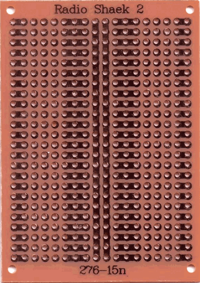 A scan of the underside of a cheap perforated prototyping circuit board - "protoboard" or "perfboard" - showing its pattern of pads and holes, along with the brand/model name "Radio Shaek 2".  :wink:

This is a typical crappy generic Chinese board, made from laminated paper.  The copper pads are very thin and the glue holding them to the board isn't great, so they lift off the board very easily when soldering, or especially desoldering.  The holes aren't very well centered in the pads.  There's no soldermask, so it's easy to get accidental solder bridges.

The board is browish tan, and has an 18 x 24 grid of holes, so 432 holes total.  There are 2 continuous busses running up the middle of the board.  On either side are rows consisting of (from outside to in) a 2-hole pad, three single-hole pads, and a 3-hole pad.