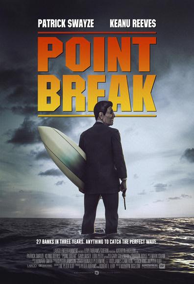 Patrick Swayze's character stands in ocean water holding a gun on his right hand and a surf board on his left and wearing his Ronald Reagan latex mask.