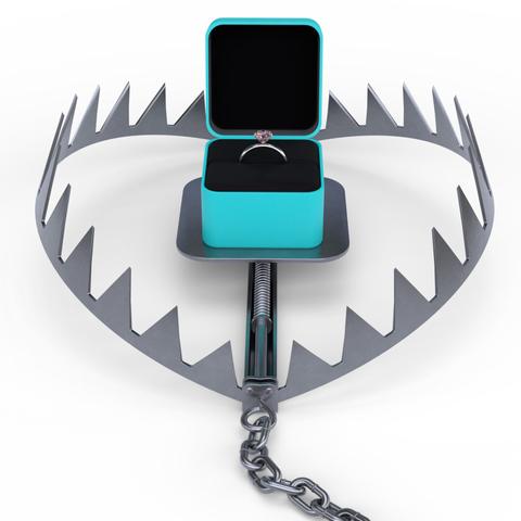 3D rendering of an engagement ring set on the plate of an open bear trap with a chain running from it.