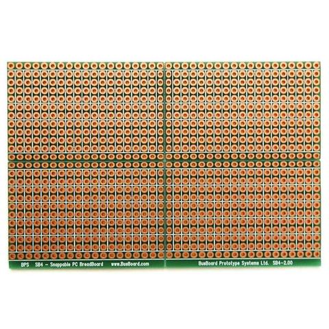 Product photograph of the Busboard Prototype Systems SB4 snappable breadboard.  This shows the top of the board, which includes silkscreened lines to indicate what the connected pad pattern on the underside is, to assist in placing components.