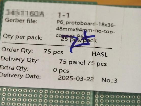 Close-up photograph of the order ID label on a package of manufactured printed circuit boards, dated 22 March 2025.