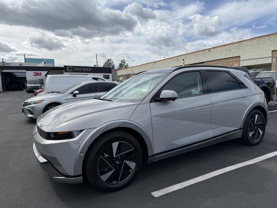 Hyundai IONIQ 5 in Cyber grey parked at the tint shop before going in