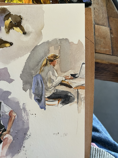 Girl working from a coffee shop