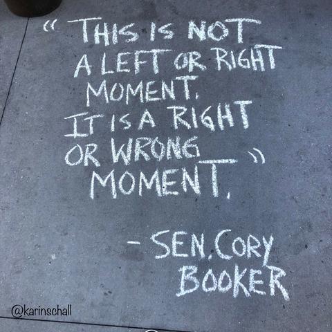 text: this is not a left or right moment. it is a right or wrong moment"
pic: text in calk on a sidewalk