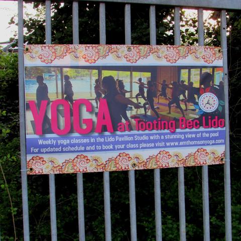 Yoga poster on Tooting Bec Lido railings