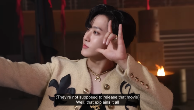 Changbin taking a selfie on the set of the LALALALA MV. Caption: (They're not supposed to release that movie) "Well, that explains it all"