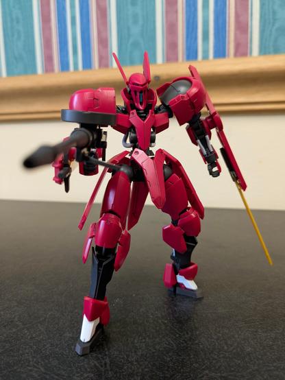 The HG Grimgerde aiming its gun at the viewer in a hip-fire position