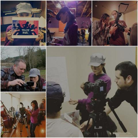 Collage comprised of six images. Top row: Me in a pinstriped hat holding up artwork with the title "Yellow Magic," a medium shot of me in a lavender shirt on a music video set; An on set photographer shows me what he has captured on his camera while I listens to phone & reviewing photos shot. Bottom row:  a camera operator in a rural area shows me shots for review; me explaininv writing on documents to people in front of a camera on a tripod; me, preparing for a studio shoot with a double bass visible. Composition is 2 rows of 3 images each. 