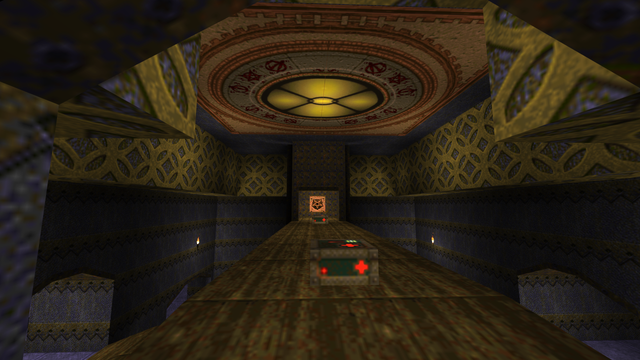 Screenshot from the game "Quake", published in 1996. The picture shows a gloomy hall, green-brownish colors are dominant. The ceiling and pilars show geometric ornaments.