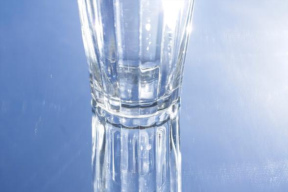Empty glass with the sky in the background.