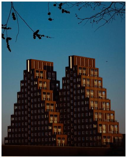 Photo of two buildings in the shape of a pyramid
