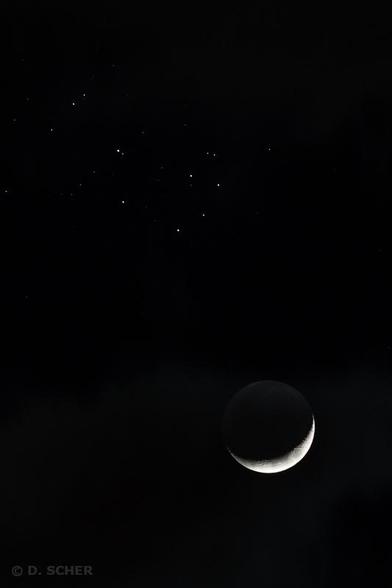 Vertical photo of the Seven Sisters open star cluster at top left, facing the Waxing Crescent Moon at bottom right.