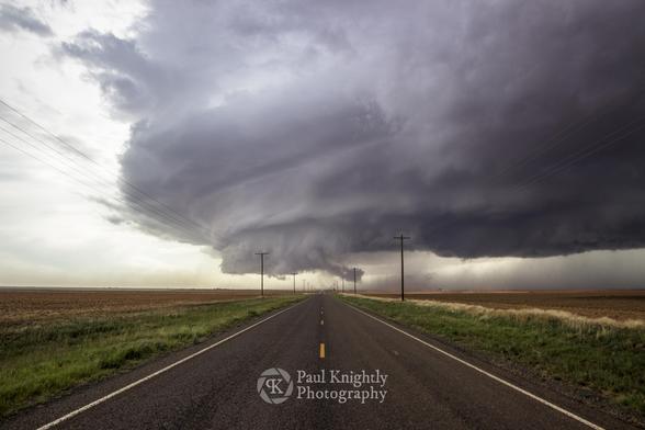 Real photo by OP: Photo of a supercell thunderstorm crossing a highway in Texas.
