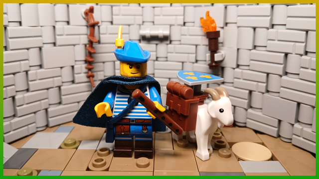 Un barde Lego en bleu avec une chèvre