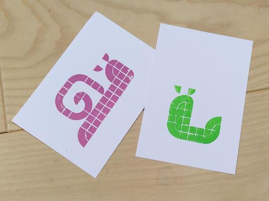 Two postcards with snail prints:
One one postcard is mauve snail. On the second one is a green slug and there is some blank space left for an other layer.