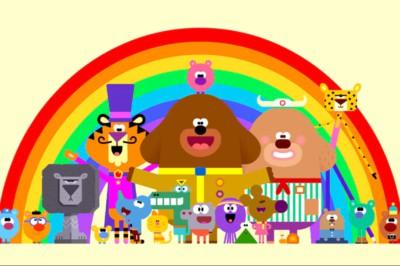 Hey Duggee cartoon characters against a rainbow background.