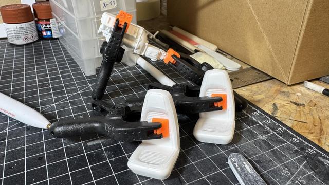 Clamped parts of a Dodge Challenger by Revell in 1:24 scale.
