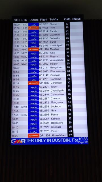 Departures board showing airline departure time at Delhi Airport Terminal 2.