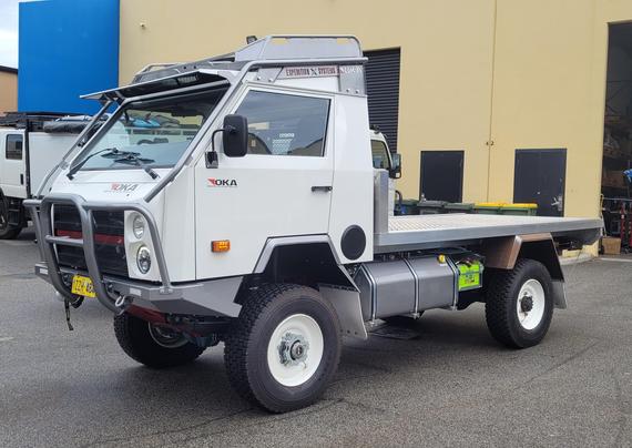 An OKA 4x4 trayback truck