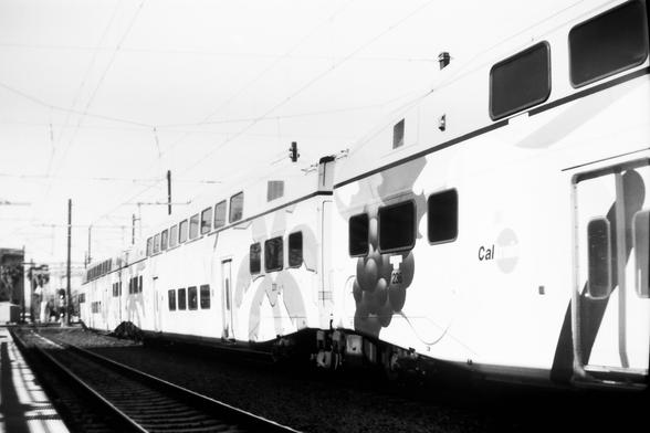 several Bombardier commuter train cars with ag theme
