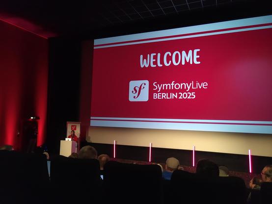 Opening session with screen showing: Welcome SymfonyLive Berlin 2025