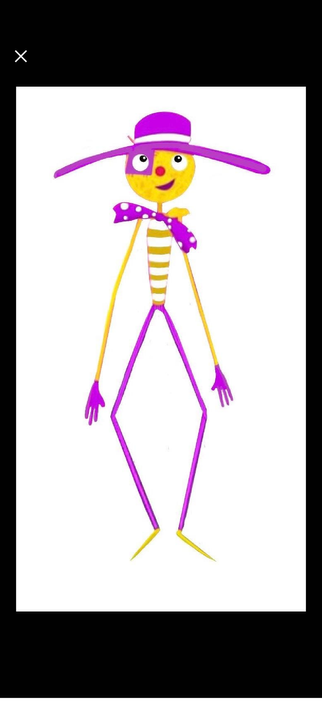 A drawing of a very long chap with skinny yellow arms with purple long four-fingered hands, long skinny purple legs with long skinny yellow feet, and a long body with a yellow and white striped top. He has a large round yellow head with two large round white eyes with black pupils and highlights in them. He has a little red button nose and is wearing a skew half moon pink smile. One of his eyes has a purple square patch underneath it. He is wearing a purple sun hat with a white band and a large, floppy brim and a purple neck tie with white polka dots.
