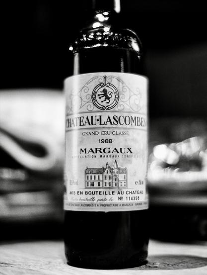 A black and white close-up of a wine bottle labeled Château Lascombes. It is a 1988 Grand Cru Classé from the Margaux appellation.